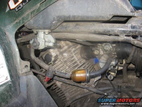 ATV engine showing fuel filter and petcock