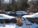 1974 Dodge Challenger - Multiple vehicles are partially obscured by snow in an outdoor setting.