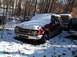 1974 Dodge Challenger - A red pickup truck sits parked in a snowy outdoor setting.