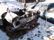1974 Dodge Challenger - This car's front end is severely damaged and covered in snow, with another vehicle nearby.