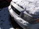 1974 Dodge Challenger - A white sedan sits in the snow, its front end damaged and covered in ice.