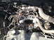 1974 Dodge Challenger - Close-up view of an engine bay, showing various mechanical parts and hoses.