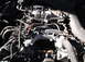 1974 Dodge Challenger - Close-up view of an engine bay, showing various hoses, the intake manifold, and other engine components.