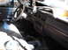 1974 Dodge Challenger - The interior of a car shows signs of disuse and neglect, with a dirty dashboard and floor.