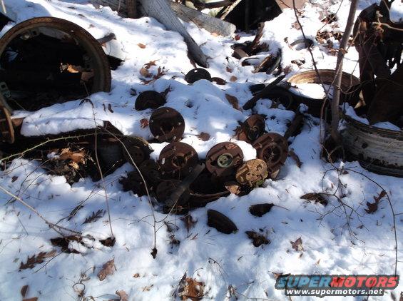 Rusty circular metal parts in the snow