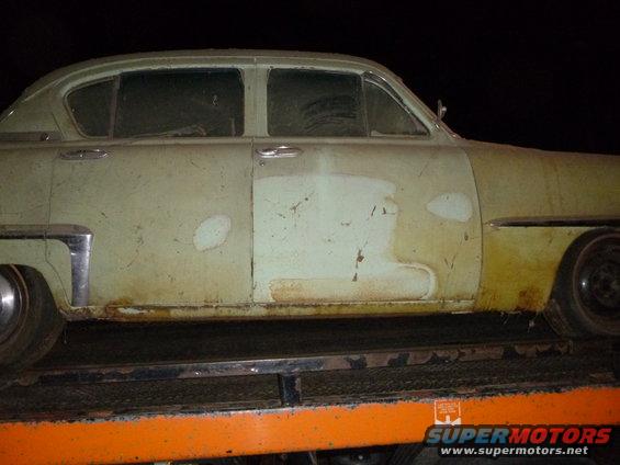 1953 Plymouth Belvedere sedan, side view, showing faded paint and rust