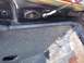 1979 Ford Bronco - Close-up view of the interior door latch mechanism and cable attachment point.