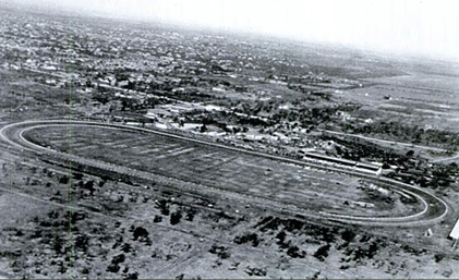 aerial view of a river winding through a wooded landscape