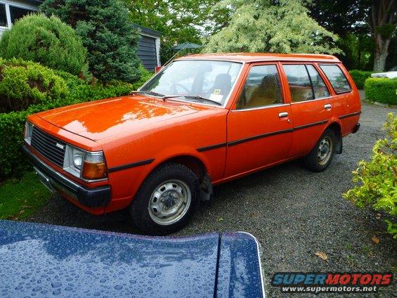 Orange station wagon, 3/4 front view