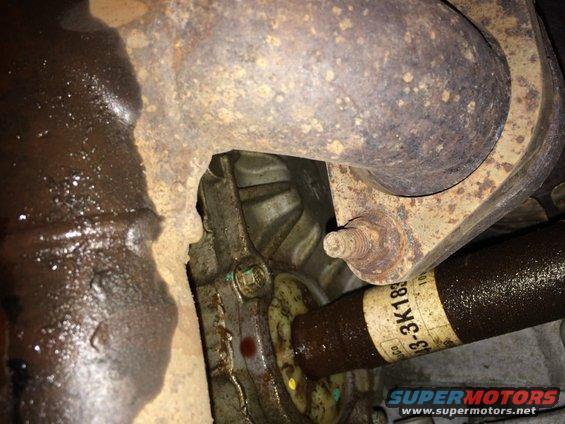 Driveshaft with part number 13-3K183 and rusty exhaust manifold