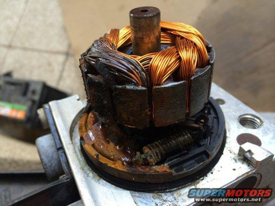 Burnt motor rotor with copper windings and damaged stator