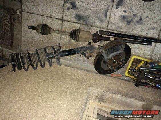 Drive axle, strut assembly, and brake rotor with tools