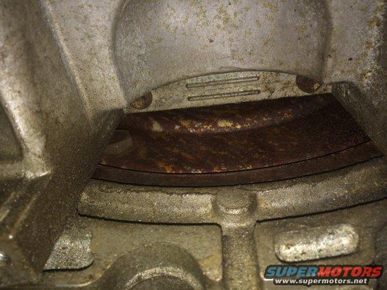 Close-up of rusty metal part within engine housing