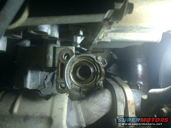 Close-up of a transmission seal housing with visible wear
