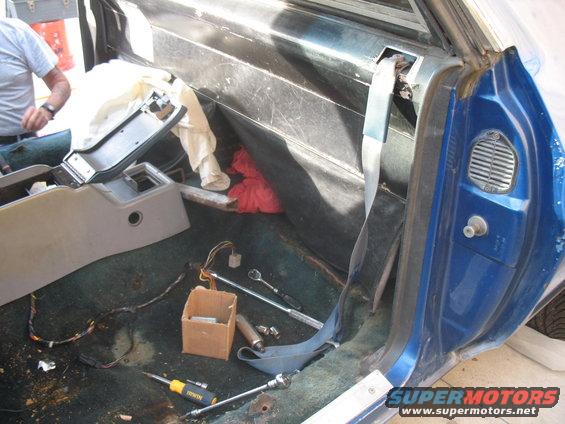 Close-up of a car's interior, showing dashboard and door panel details