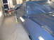 1972 Ford Ranchero - A freshly painted blue 1972 Ford Ranchero is seen in a paint booth, partially covered.