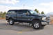2005 Ford F-250 - This 2005 Ford F-250 Super Duty truck is equipped with a camper shell and chrome wheels.