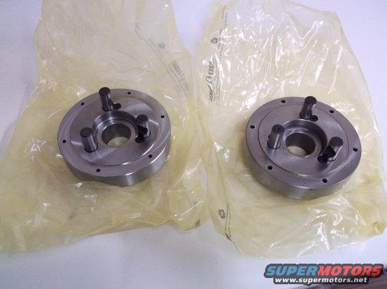 Two metal chucks in plastic packaging, one with visible text "SUPERMOTORS"