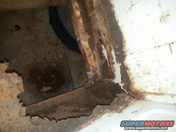 rusted frame and spare tire well