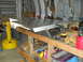 1992 Ford Bronco - A metal fabrication project is underway in a workshop, with various tools and equipment visible.