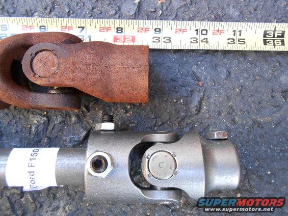 Rusty universal joint next to a new steering shaft labeled "Ford F150"