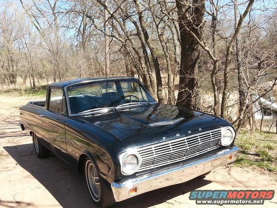 1963 Ford Ranchero parked outdoors with trees in background