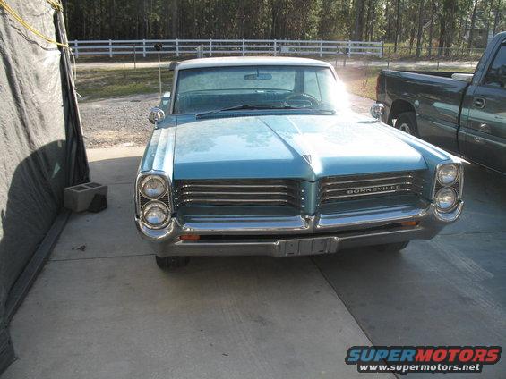 Blue 1963 Pontiac Bonneville front view with chrome grille and stacked headlights