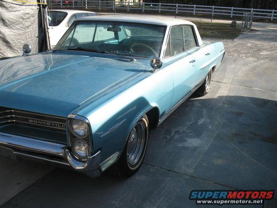 Light blue 1963 Pontiac Bonneville with a white roof parked outside