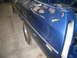 1972 Ford Ranchero - The rear quarter panel of a blue vehicle shows signs of bodywork and is missing its tail light assembly.