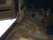 1991 Ford Bronco - Interior floor pan shows significant rust damage.