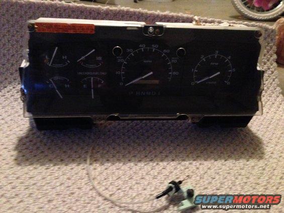 Vehicle instrument cluster with speedometer, tachometer, fuel gauge, and temperature gauge