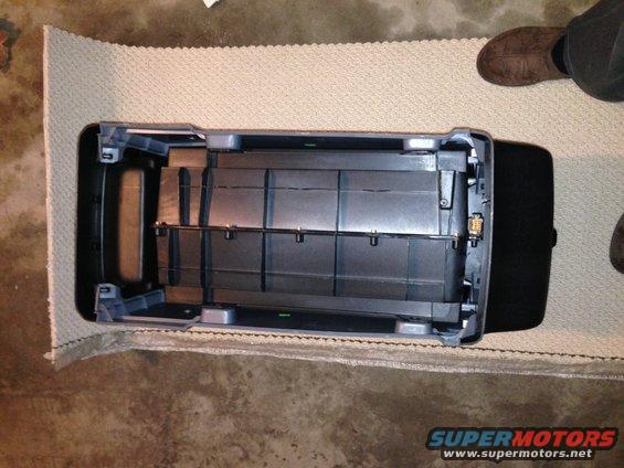 Ford Bronco center console removed from vehicle, showing storage compartments