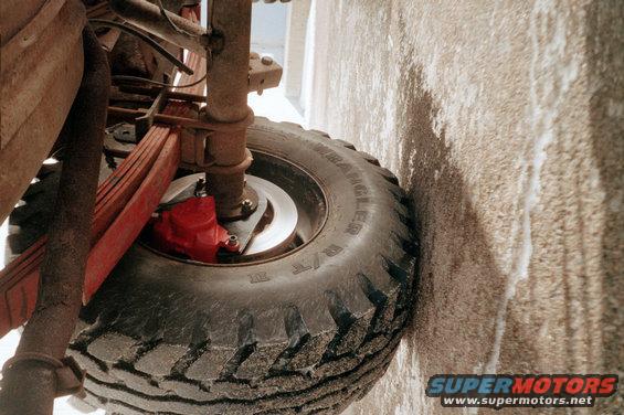Red brake caliper and tire on a vehicle
