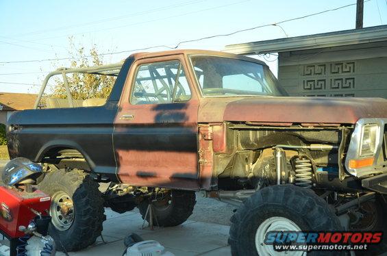 1979 Ford Bronco with roll cage, undergoing modifications