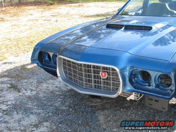 Blue 1972 Ford Ranchero front end with prominent grille and hood scoops