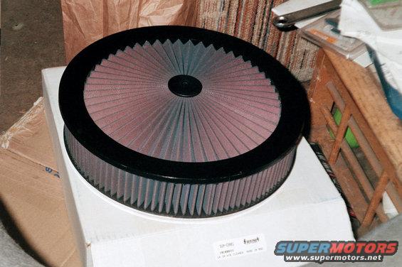 K&N air filter on a box. Text on filter reads 'K&N AIR CLEANER MADE IN USA'