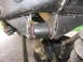 1988 Ford Bronco - A detailed view of a vehicle's suspension system, focusing on a worn bushing and its mounting bracket.