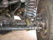 1988 Ford Bronco - Front axle and suspension components are visible in this close-up shot.