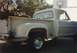 1968 Ford F-100 - Side view of a white 1968 Ford F-100 pickup truck with aftermarket chrome wheels.