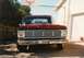 1967 Ford F-100 - Front view of a red 1967 Ford F-100 pickup truck parked in a driveway.