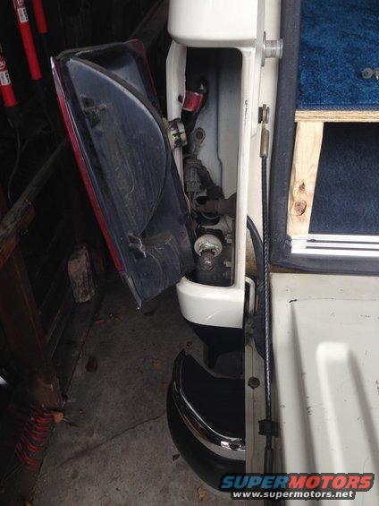 img_0825.jpg 4 screws hold on the light lens.  2 on the exterior and 2 accessed once the tailgate is down.  Twist the socket out of its mount in the lens.  Then unclip bulb.  