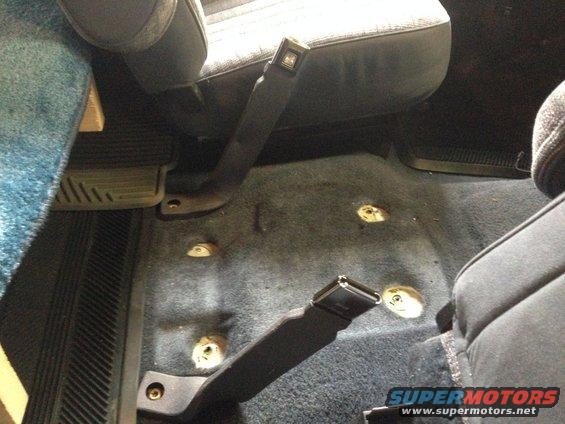 Console out.  Made sure to put anti-seize on the mounting threads.  The bolts come through the body of the cab.  