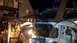1993 Mercury Tracer - Work light illuminates the engine bay of a white vehicle, with a wooden beam and level visible.
