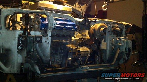 Engine bay with turbocharger and blue engine components
