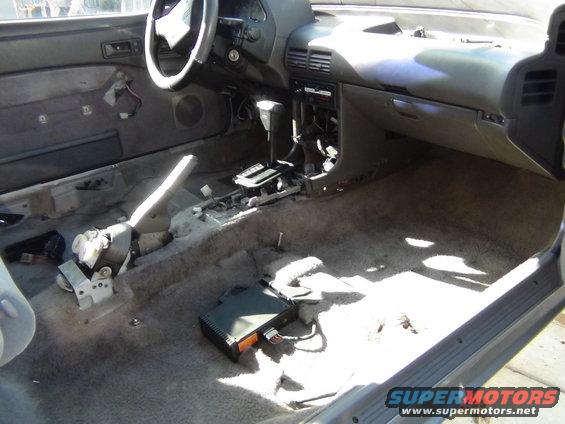1991 Ford Probe interior, stripped down with exposed wires and carpet removed