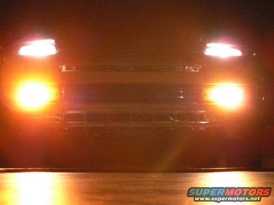 1991 Ford Probe front view with headlights and fog lights illuminated