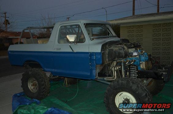 1978 Ford Bronco body with engine bay open, showing engine and suspension components