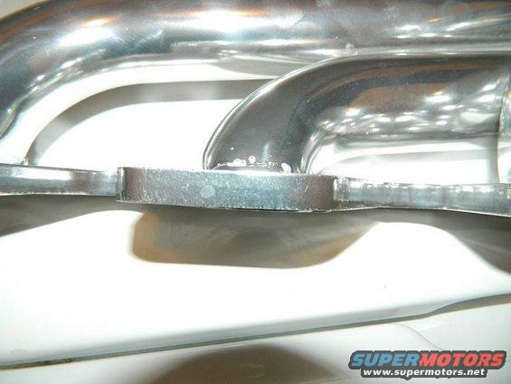 Exhaust manifold with polished chrome pipes and flange