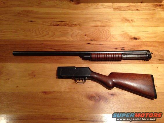 shotgun barrel and stock on wooden surface