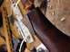 1996 Ford Bronco - A close-up view of a wooden part with a contrasting wood inlay, showing the grain and texture.